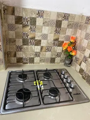 a stove top in a kitchen with a tile wall at Apartamento en Getsemaní in Cartagena de Indias