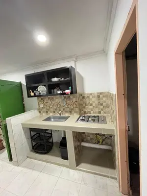 a small kitchen with a sink and a stove at Apartamento en Getsemaní in Cartagena de Indias