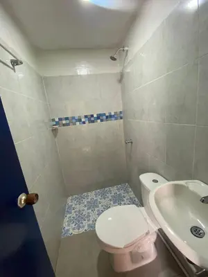 a small bathroom with a toilet and a sink at Apartamento en Getsemaní in Cartagena de Indias