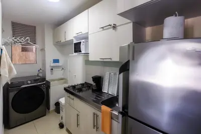 a kitchen with a stainless steel refrigerator and a stove at Apartamento Cielo Cartagena in Cartagena de Indias