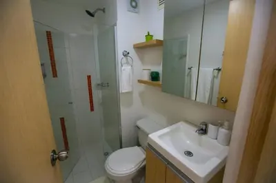 a bathroom with a shower and a toilet and a sink at Apartamento Cielo Cartagena in Cartagena de Indias