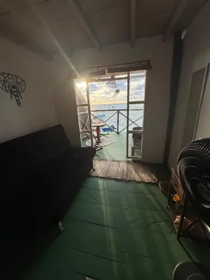 a room with a room with a view of a patio at Tequila SunBeach Baru Eco-Hotel in Baru