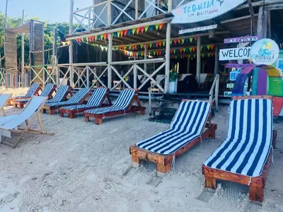 a row of lounge chairs in front of a store at Tequila SunBeach Baru Eco-Hotel in Baru