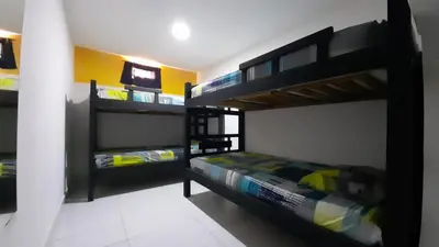 a bedroom with two bunk beds in a room at HOSTAL EL ALTISIMO in Cartagena de Indias