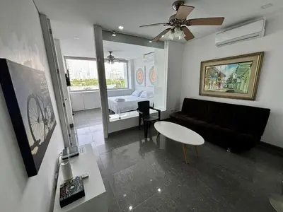 a living room with a couch and a table at Apartamento en Laguito Ed. Cristoforo 303 ICDI in Cartagena de Indias