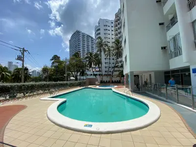 a swimming pool in the middle of a building at Apartamento en Laguito Ed. Cristoforo 303 ICDI in Cartagena de Indias