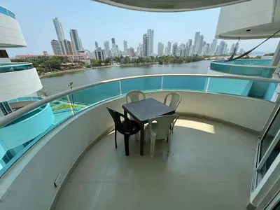a balcony with a table and chairs on a ship at Apartamento en Laguito Ed Torres del Lago 604 ICDI in Cartagena de Indias