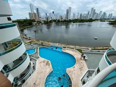 a view of a river and a swimming pool on a cruise ship at Apartamento en Laguito Ed Torres del Lago 604 ICDI in Cartagena de Indias