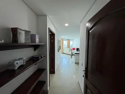 a room with a hallway with a kitchen and a door at Apartamento en Laguito Ed Torres del Lago 604 ICDI in Cartagena de Indias