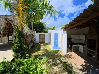 a courtyard of a house with a palm tree at CountrySide Stay Melina in San Mateo