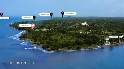 an island in the middle of the water with four black arrows at Deluxe Family Suite - In front of the sea in Moñitos