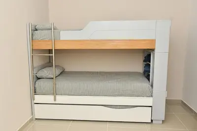 a white bunk bed in a room at Excelente ubicación, cómodo apartamento in Barranquilla
