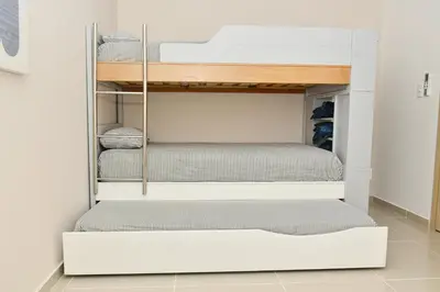 a walk in closet with two bunk beds at Excelente ubicación, cómodo apartamento in Barranquilla