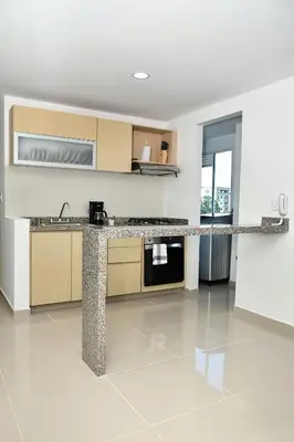 a kitchen with a counter top in a room at Apartamento familiar con excelente ubicación Barranquilla in Barranquilla