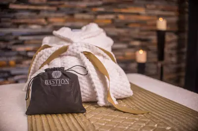 a bag sitting on top of a bed at Bastión Luxury Hotel in Cartagena de Indias
