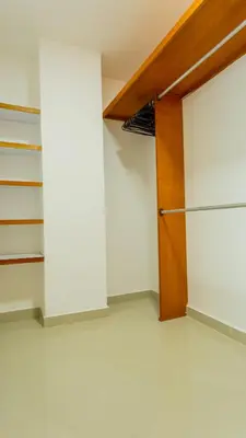 a room with a closet with a wooden door at Penthouse Marea Con Jacuzzi Privada Vista Mar in Cartagena de Indias