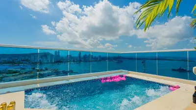 a swimming pool on a balcony with a view of the water at Penthouse Marea Con Jacuzzi Privada Vista Mar in Cartagena de Indias