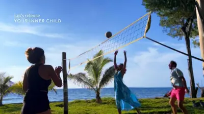 a group of people playing volleyball on the beach at Beach House with AC Surrounded by Nature in Moñitos