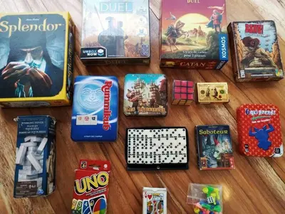 a group of board games and cards on a table at Beach House with AC Surrounded by Nature in Moñitos