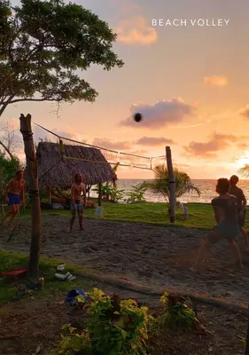 a group of people playing a game on the beach at Beach House with AC Surrounded by Nature in Moñitos
