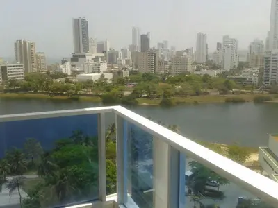 a view of a city from the balcony of a building at Apartamento con vista al laguito y al mar in Cartagena de Indias