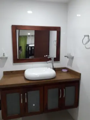 a bathroom with a white sink and a mirror at Apartamento con vista al laguito y al mar in Cartagena de Indias