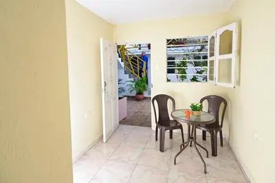 a dining room with a table and chairs at Casa Hotel Terraza del Cabrero in Cartagena de Indias
