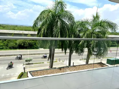 a view of a street with palm trees from a building at MORROS EPIC Un refugio frente al mar in Cartagena de Indias