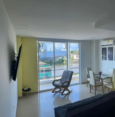 a living room with a couch and a table and chairs at Apartamento 202 in Cartagena de Indias