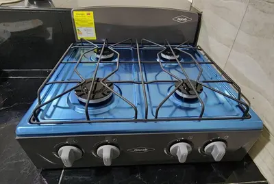 a blue stove top oven sitting on a counter at Lindo Apartamento cerca al Estadio Metropolitano in Barranquilla