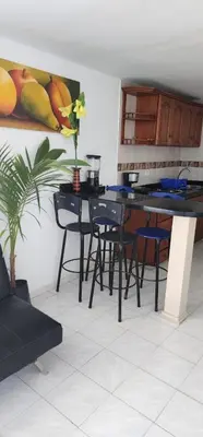 a dining room with a table and chairs at Hermoso apartamento con vista al mar in Cartagena de Indias