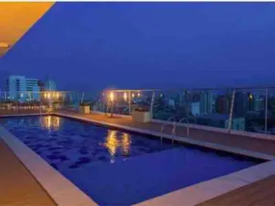 a large swimming pool on the roof of a building at Amazing views in Barranquilla in Barranquilla