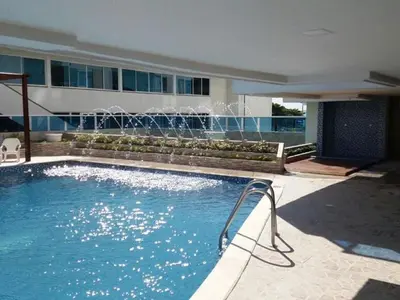 a swimming pool with a fountain in a building at Apartment 1C11 Near The Sea With Pool in Cartagena de Indias