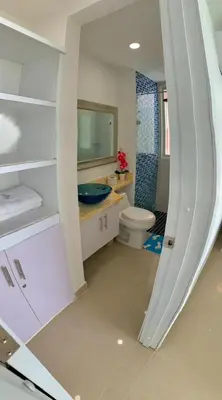 a bathroom with a sink and a toilet and a mirror at Apartment al-2 facing the sea with Wifi in Cartagena de Indias