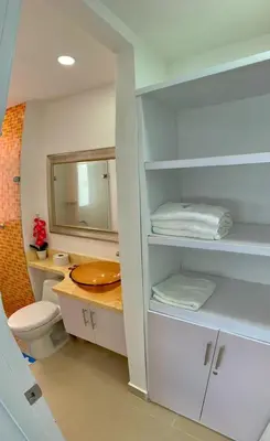 a bathroom with a sink and a toilet and a mirror at Apartment al-2 facing the sea with Wifi in Cartagena de Indias