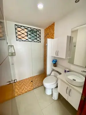 a bathroom with a toilet and a sink and a shower at Apartment al-1 facing the sea with pool and Wifi in Cartagena de Indias