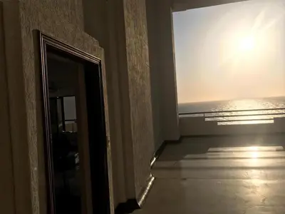 a mirror in a room with a view of the ocean at 3MR8 Duplex Apartment Close To The Sea With Pool in Cartagena de Indias