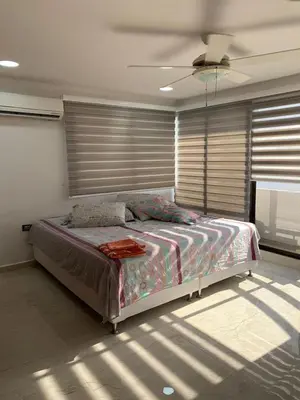 a bedroom with a bed and a ceiling fan at 3MR8 Duplex Apartment Close To The Sea With Pool in Cartagena de Indias