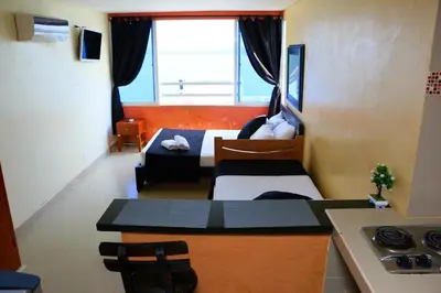a room with a kitchen and a living room at Studio Apartment E19C Close To The Sea And Pool in Cartagena de Indias