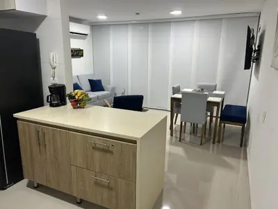 a kitchen and dining room with a table and chairs at Apartamento en Barranquilla Zona Norte Miramar in Barranquilla