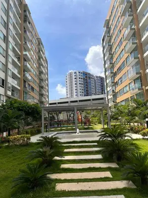 a walkway in the middle of a city with tall buildings at Apartamento en Barranquilla Zona Norte Miramar in Barranquilla