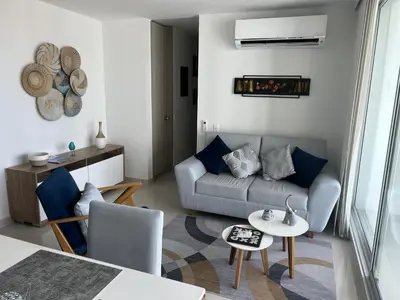 a living room with a couch and a table at Apartamento en Barranquilla Zona Norte Miramar in Barranquilla