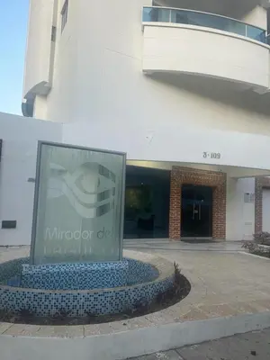 a large building with a sign in front of it at Exquisite apartment in El Laguito Cartagena in Cartagena de Indias