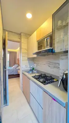 a kitchen with a stove top oven in a room at Suite privada frente al mar, Tolú in San Silvestre