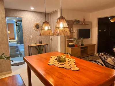 a living room with a wooden table with cookies on it at Boho style house in Cartagena de Indias