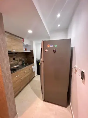 a kitchen with a stainless steel refrigerator at Boho style house in Cartagena de Indias