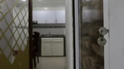 a door with a view of a kitchen in a room at Hostal Viva Mar in Cartagena de Indias