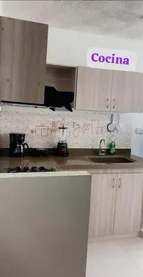 a kitchen with a counter top with writing on the wall at Apartamento Amoblado Cartagena in Cartagena de Indias