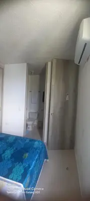 a room with a bed and a bathroom with a toilet at Apartamento Amoblado Cartagena in Cartagena de Indias