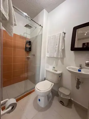a bathroom with a toilet and a shower and a sink at Apartamento Amoblado Cartagena in Cartagena de Indias
